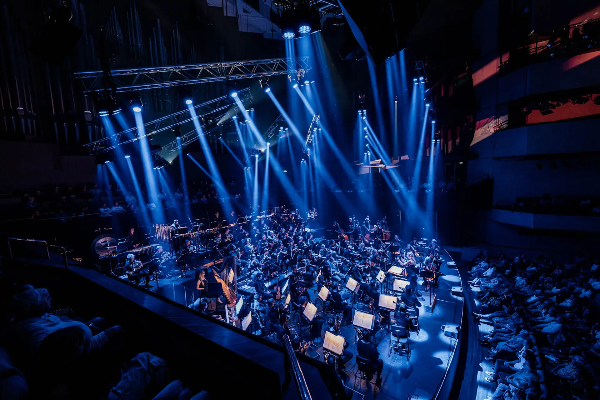 Chevron lighting rig suspended above the orchestra at QPAC